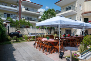 Texas BBQ catering setup with outdoor tables and canopy at backyard event