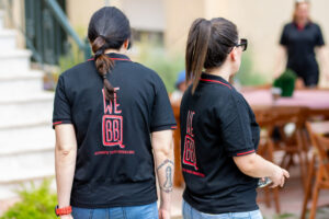 Texas BBQ catering team with branded shirts at outdoor event